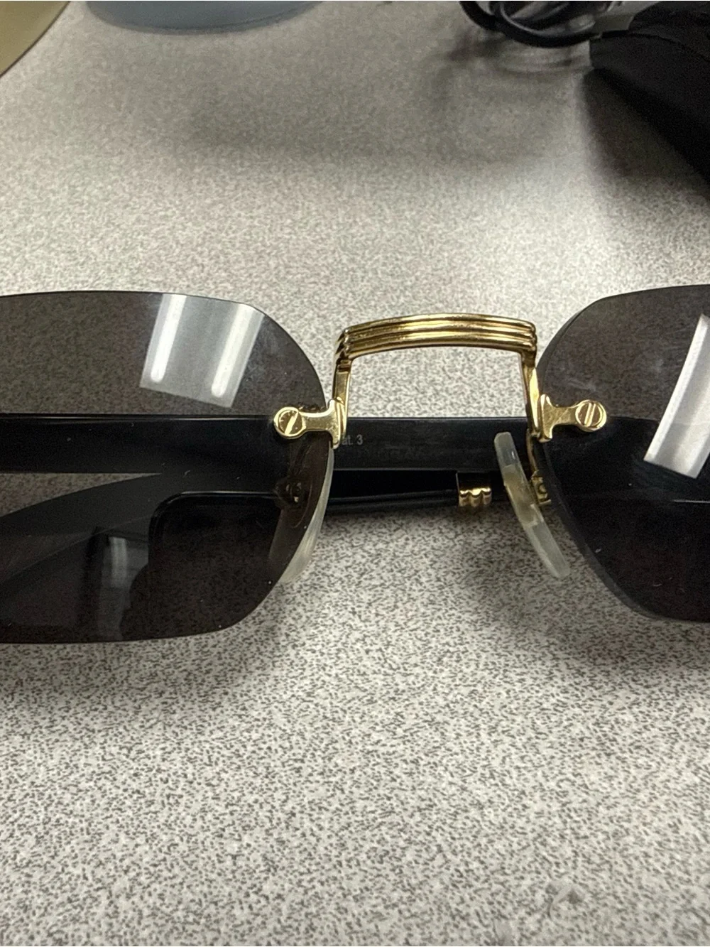 Cartier Gold Bridge Black Lens Rimless Sunglasses